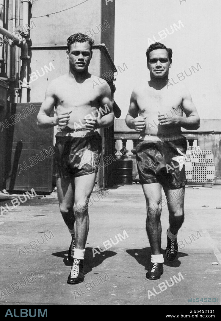 Newcastle welteweight boxers, Alfie Sands (left) and George Sands, having a jog today before completing their training for bouts against Victorians at West Melbourne Stadium tomorrow night. November 10, 1947.
