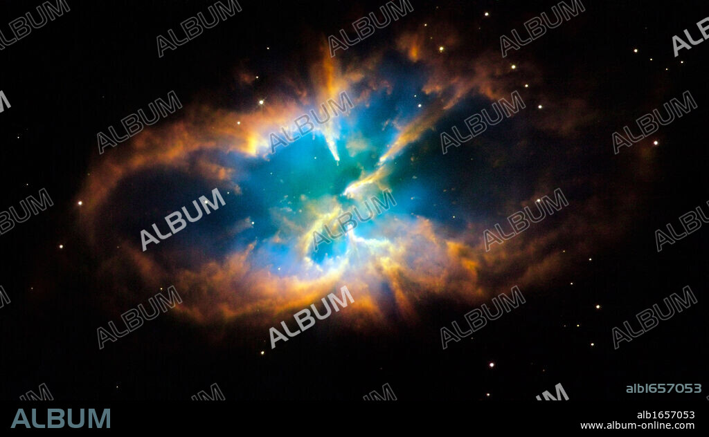 Planetary nebula NGC 2818 in the southern constellation of Pyxis (The Compass). Glowing layers and shell of gas were created when a star shed its outer layers into space after running out of nuclear fuel. Credit NASA. Science Astronomy.
