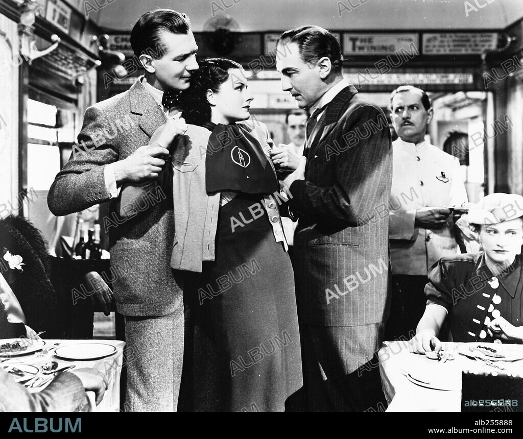 MARGARET LOCKWOOD and MICHAEL REDGRAVE in THE LADY VANISHES, 1938, directed by ALFRED HITCHCOCK. Copyright GAINSBOROUGH FILMS.