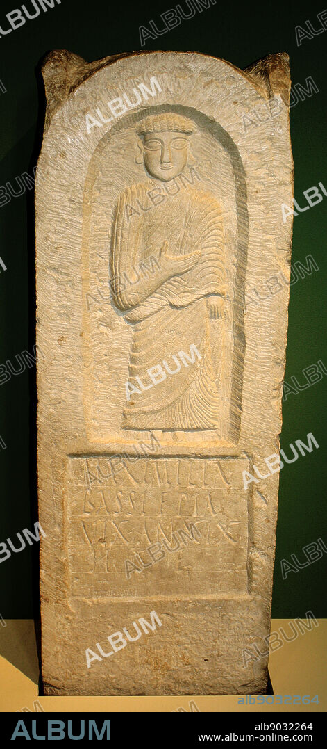 Limestone tombstone for Maximilla Bassi. Tunisia, Punic, 2nd-3rd century AD from Carthage. This finely carved monument was set up in memory of a woman called maximilla Bassi. The Latin inscription says 'Maximilla Bassi, pious daughter, lived nineteen years. Here she is placed.' After the Roman annexation of Carthage in 146BC it became more fashionable to use Latin for inscriptions although Phoenician remained the everyday language used. The shallow niche is carved with an image of a female figure wearing a pleated tunic and mantle, presumably Maximilla.