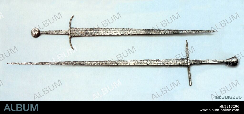 The Arming sword (Knightly sword) was the most widespread type of sword in the European High Middle Ages. It was a straight, double-edged weapon with a single-handed cruciform hilt and a blade length of about 28 to 31 inches. The type is frequently depicted in period artwork, and numerous examples have been preserved archeologically. The high medieval sword of the Romanesque period (10th-13th centuries) develops gradually from the Carolingian sword (spatha) of the 9th century. In the Late Medieval period (14th and 15th centuries), late forms of these swords continued to be used, but often as a sidearm, especially of the estoc type, now called "arming sword" and contrasting with the two-handed, heavier longsword.