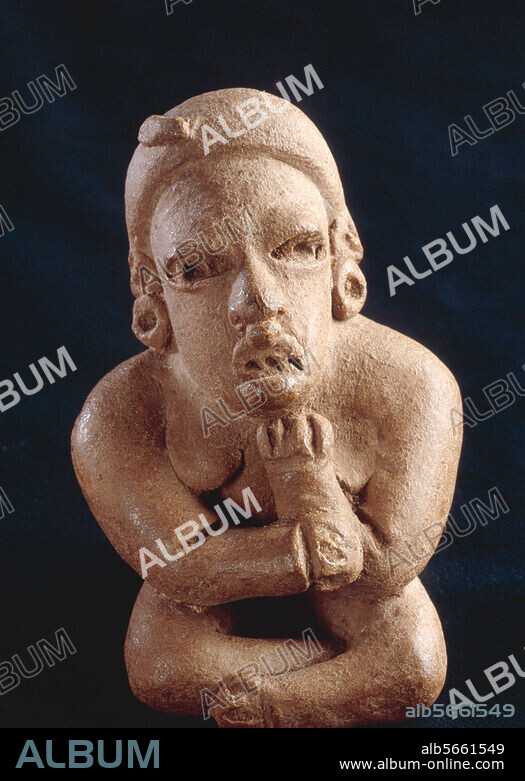 Maya Culture. Figure of a seated woman with crossed arms and legs. Clay, modelled and carved with appliqué, height 10.7 cm. Origin: San Agustin Acasaguastlan, El Progreso, Guatemala. Guatemala, Museo Nacional de Arqueologia.