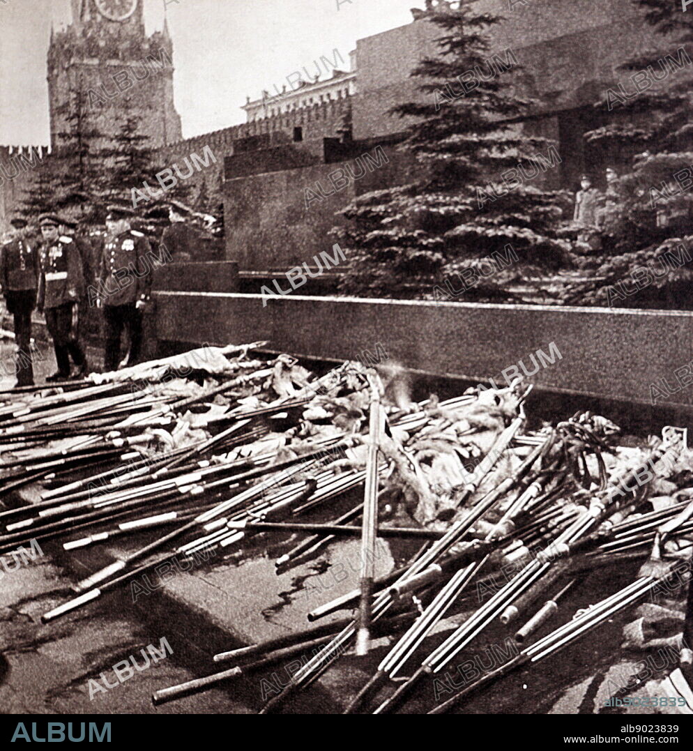 Nazi banners and symbols are gathered to be publicly burned in Red Square Moscow. 1945.