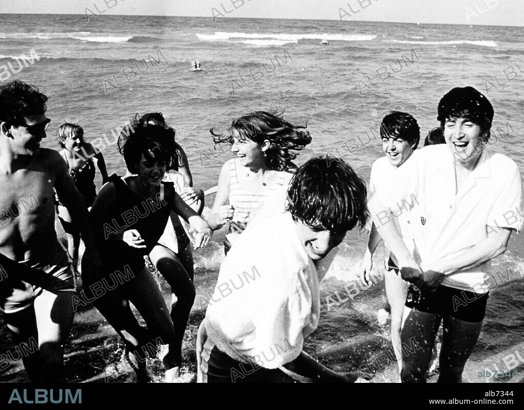 The Beatles on the beach at Miami, 1964.