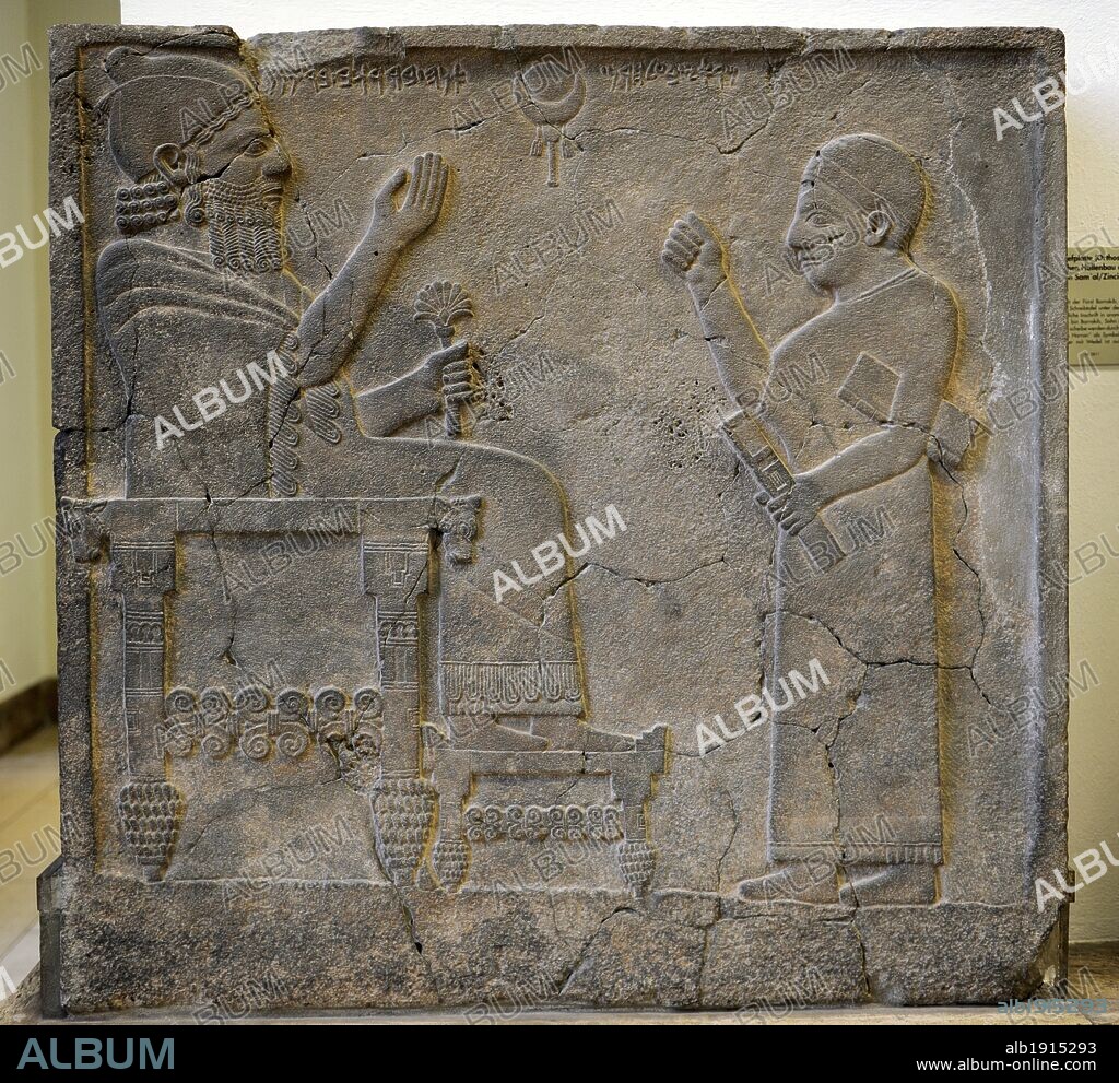 Hittite art. Orthostat or stele of King Bar-Rakib (Barrakit 744-727 BC)  sitting on the throne .750 BC. Zone of Sma'al /Zincirli (Turkey) to South of Turkey. Detail. Pergamon Museum. Museum Island. Berlin. Germany.
