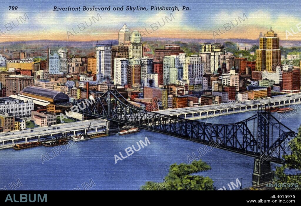 Riverfront Boulevard and city skyline, Pittsburgh, Pennsylvania, USA, 1940. Postcard. Bird's eye view of the Pittsburgh skyline, Riverfront Boulevard, the river and bridge crossing the river.