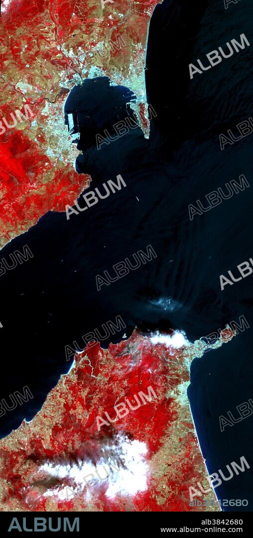 The Strait of Gibraltar separates Spain from Morocco. This image, acquired on July 5, 2000, covers an area 21 miles wide and 37 miles long in three bands of the reflected visible and infrared wavelength region. The promontory on the eastern side of the conspicuous Spanish port is the Rock of Gibraltar. The rocky limestone and shale ridge rises abruptly from the sea, to a maximum elevation of 1,398 feet. A British colony, Gibraltar occupies a narrow strip of land at the southernmost tip of the Iberian Peninsula. It is separated from the Spanish mainland by a neutral zone contained on a narrow, sandy isthmus. Because of its strategic location and formidable topography, Gibraltar serves mainly as a British fortress. Advanced Spaceborne Thermal Emission and Reflection Radiometer (ASTER) is one of five Earth-observing instruments launched December 18, 1999, on NASA's Terra satellite.The broad spectral coverage and high spectral resolution of ASTER will provide scientists in numerous disciplines with critical information for surface mapping and monitoring dynamic conditions and temporal change.