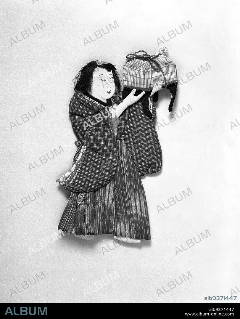 Oshi-e, 'Push Picture', Little Boy Holding Insect Cage for Suzumushi, 'Bell Bug, ' A Singing Insect like a Cricket, Cloth and cardboard, Japan, 19th century, Meiji Period, 9 1/2 x 6 1/2 in., 24.1 x 16.5 cm.
