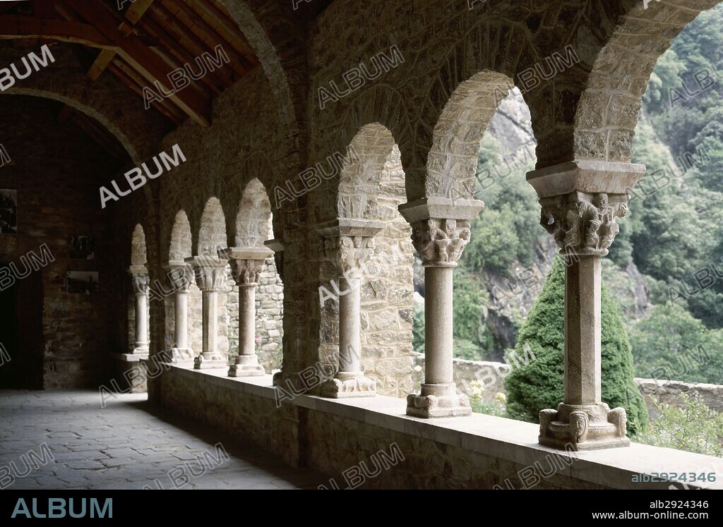 France. Pyrenees-Orientales. Languedoc-Roussillon region. Abbey of Saint-Martin-du-Canigou. Monastery built in 1009, on Canigou mountain by Guifred, Count of Cerdanya, in Romanesque style. Architectural detail of a cloister gallery . Restoration of 1900-1920. The first level was built in early 11th century, the second one in late 12th century.