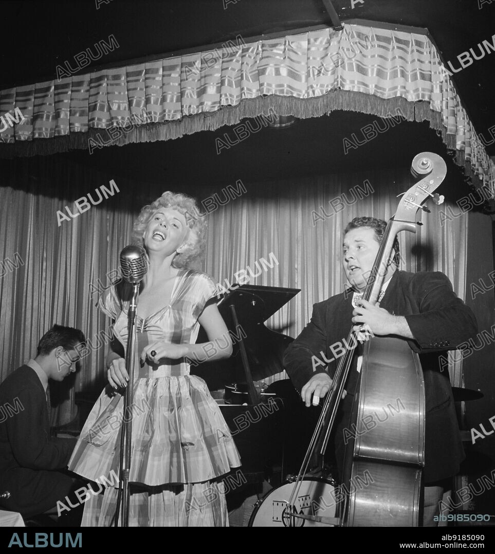 WILLIAM PAUL GOTTLIEB. Portrait of Chubby Jackson and Dottie Reid, Onyx, New York, N.Y., ca. July 1947.