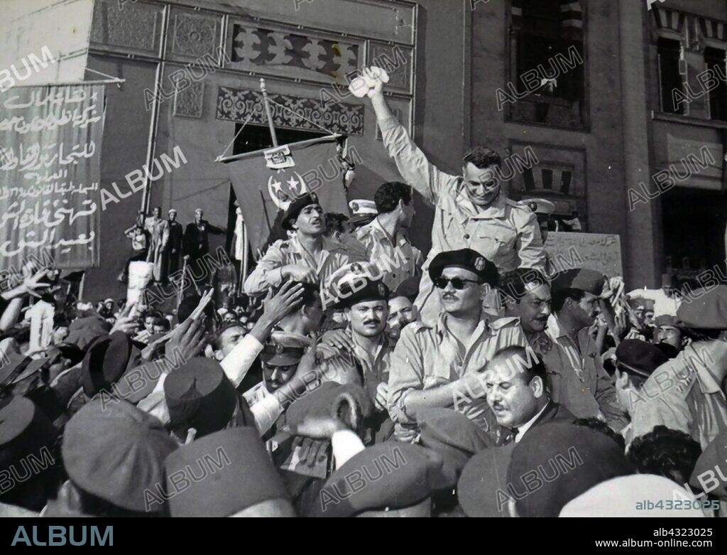 Gamal Abdel Nasser and members of the RCC, welcomed by cheering crowds in Alexandria 1954, after the signing of the British withdrawal order. (Salah Salem seated in front of Nasser with sunglasses), Kamal el-Din Husseini (behind Salem), Anwar Sadat (only partially visible, behind Husseini), Abdel Hakim Amer (standing behind Nasser, face not seen). Gamal Abdel Nasser (1918 - 1970), President of Egypt, serving from 1956 until his death in 1970. Nasser led the 1952 overthrow of the monarchy and introduced far-reaching land reforms the following year.