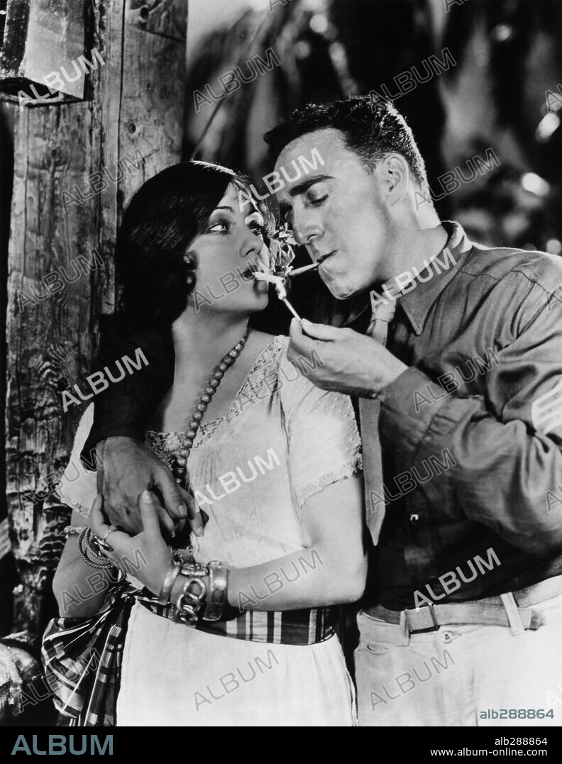 GLORIA SWANSON and RAOUL WALSH in SADIE THOMPSON, 1928, directed by RAOUL WALSH. Copyright UNITED ARTISTS.