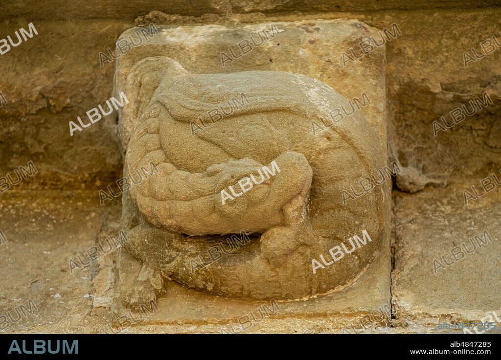 dragon biting its tail, Church of Santiago de Agüero, Agüero, Huesca, Spain.