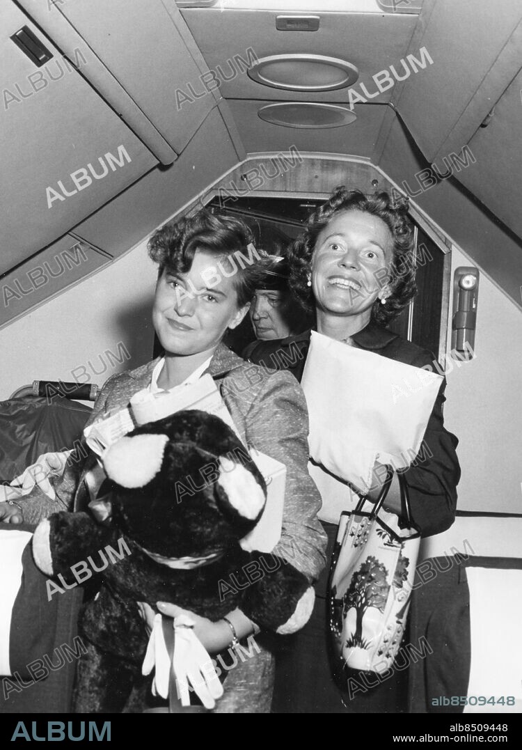 NEW YORK 1957-06-22. 16 year old Christina Wennerström is shown inside a Scandinavian air plane with her mother MRS Ulla-Greta Wennerström before taking off from Idlewild Airport for home today. The doughter of Swedissh Air Force attache, Christina is being rushed back to to Sweden , bringing to an end , temporarliy at least her romance with Huw Williams, 18 year old ex-senate page boy. The romantic youngsters eloped and spent more than 2 weeks in unwed bliss in Canada. They were returned to Washington D.C. Thursday after being picked up for speeding charge.. Photo: International News Photos / TT / Kod: 190.
