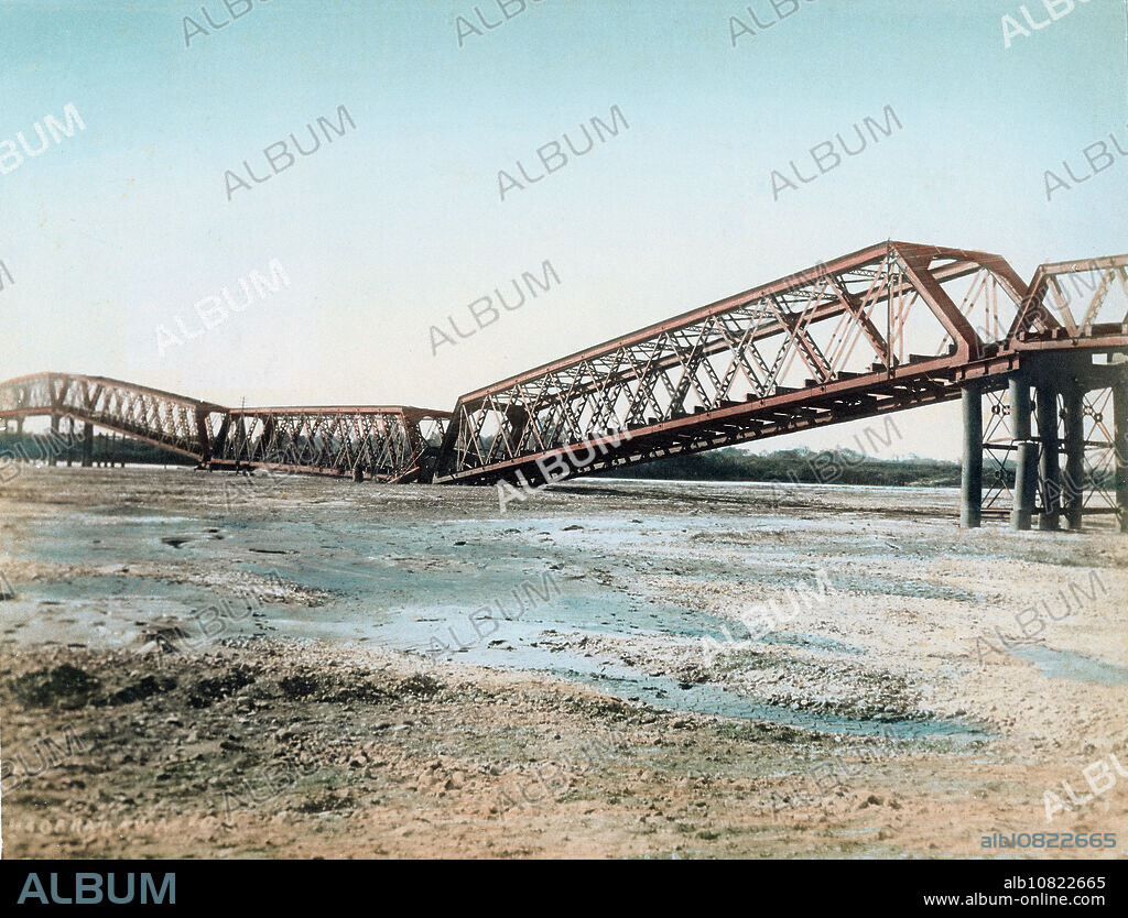 [ 1890s Japan - Nobi Earthquake Destruction ] A collapsed Nagaragawa Railway Bridge on the Tokaido Main Line () in Gifu Prefecture after the Nobi Earthquake (, Nobi Jishin) of October 28, 1891 (Meiji 24). The bridge was completed only four years earlier, in 1887 (Meiji 20). It was the largest railway bridge in Japan at the time. 19th century vintage albumen photograph.