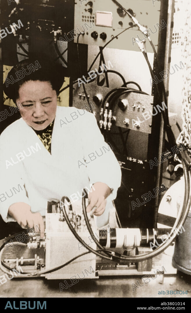 Chien-Shiung Wu (1912-1997), Chinese-US physicist, in 1958. She is working in her laboratory at New York's Columbia University, USA, where she became physics professor in 1957. In 1956, Wu and Tsung-Dao Lee experimentally confirmed a theory that parity is violated during weak radioactive decay, overturning many basic assumptions of particle physics. Wu experimentally confirmed other particle theories, as well as studying muonic atom X-ray spectra.