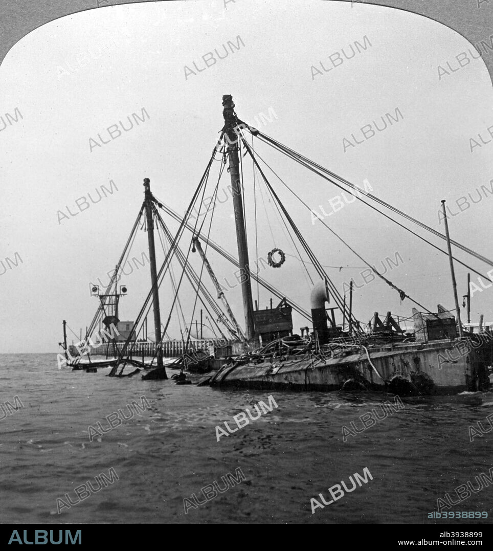 Sunken warship HMS 'Vindictive', Ostend, Belgium, World War I, 1918. A cruiser launcehed in 1897, HMS 'Vindictive' was modified in 1918 with her guns replaced by howitzers, flame throwers and mortars to launch attacks on the German-held Belgian Channel ports of Zeebrugge and Ostend. She was heavily damaged in the first raid on Zeebrugge on 23rd April and was then sunk as a blockship during the Second Ostend Raid on 10th May. Stereoscopic card detail.