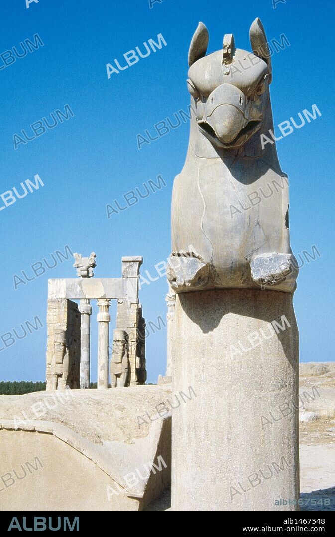 Persian Art. Achaemenid period. Persepolis (Takht-e-Jamshid). Capital with a griffin, dated during the reign of Xerxes (486-465 BC). In the background, the Gate of all Nations or Gate of Xerxes. Islamic Republic of Iran.