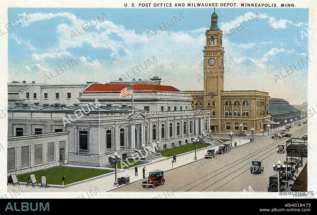 US Post Office and Milwaukee Road Depot, Minneapolis, Minnesota, USA, 1928. Vintage postcard. The Milwaukee Road Depot was a station on the Chicago, Milwaukee, St Paul and Pacific Railroad. The Rennaisance Revival building, built in 1899, has a pinnacled clock tower. The pinnacle was destroyed by strong winds in 1941. A new Post Office building was completed in 1933.