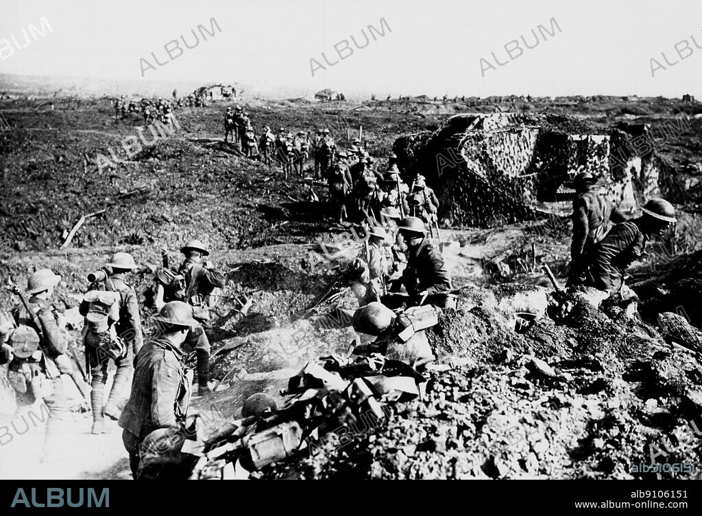 WW1/France: Battle of Polygon Wood. Camouflaged tanks and infantry moving up to attack. Shell bursts in the distance. Clapham Junction on the Menin Road about 3.5 miles east of Ypres. 26th Sept. 1917.