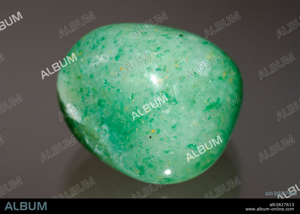 Aventurine is a form of quartz, characterized by its translucency and the presence of platy mineral inclusions that give a shimmering or glistening effect termed aventurescence. This particular aventurine specimen came from South Africa. Specimen Dimension: approximately 2 cm.