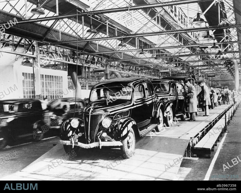 Ford factory, Dagenham, Essex, 1937. 22 hp Ford V8 Saloons being driven off the production line. When production began at the site in 1931, Ford's Dagenham plant was the most modern and best-equipped car factory in the world outside of Detroit. It was also the largest car production plant in Europe.
