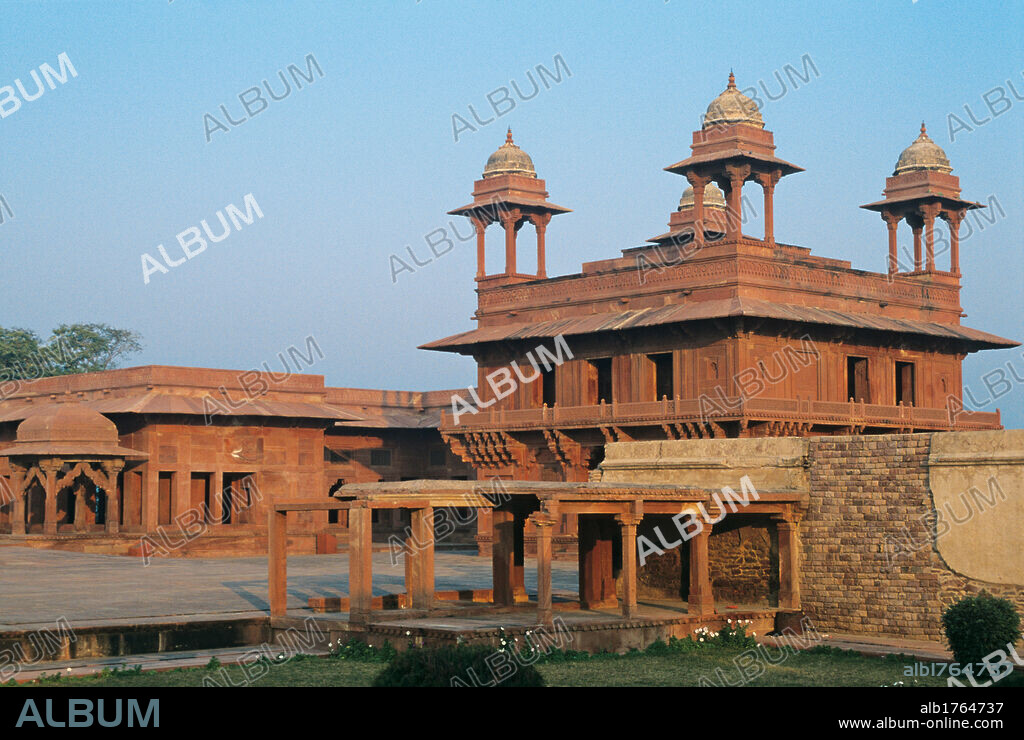 Diwan i Kass, by Unknown Artist, 1571, 16th Century,. India, Uttar Pradesh, Agra, Fatehpur Sikri, Diwan-i Khass. Citty of Fathpur Sikri Palace of the Private Hearings Diwan i hass seat of the astrologer Ankh Michauli red sandstone, two story building, surrounded by an uninterrupted balcony that enhances its symmetry, chattri on each corner of the roof. 2009 photograph.