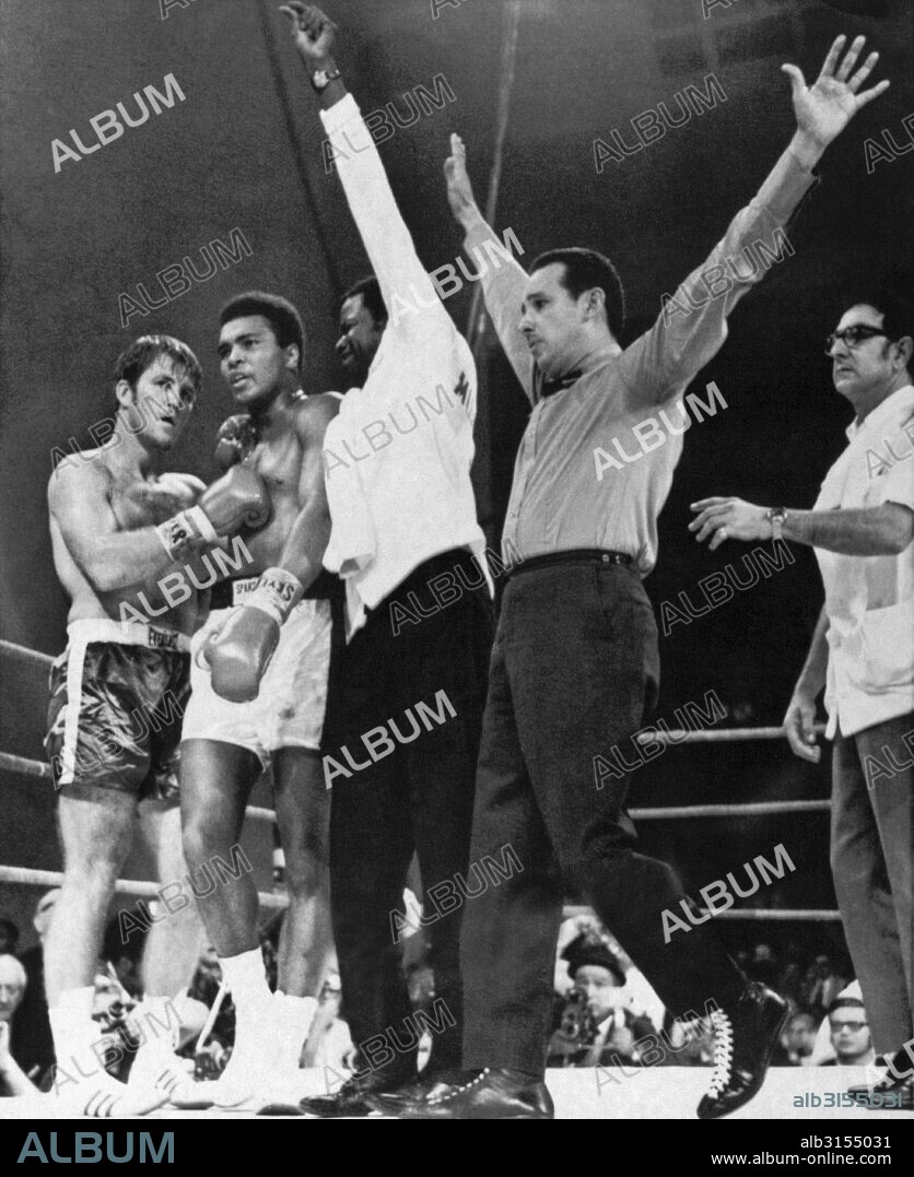 Atlanta, Georgia:  October 26, 1970. Referee Tony Perez signals the end of the fight between Muhammad Ali and Jerry Quarry. Angelo Dundee, Ali's manager, is at the right.