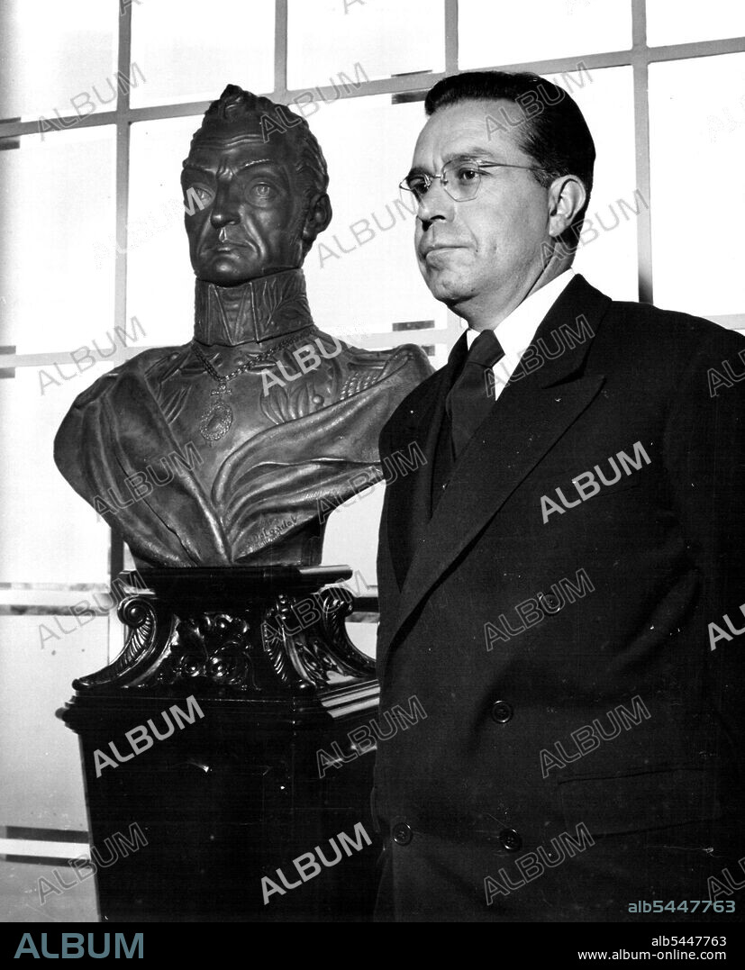 Cities Of The World - La Paz Bolivian President Victor Paz Estenssoro poses in his La Paz officer beside a bust of Simon Bolivar, the great liberator for whom Bolivia is named. Sucre is the legal capital of Bolivia, but the government rules from the more accessible city of La Paz. April 8, 1955. (Photo by United Press).
