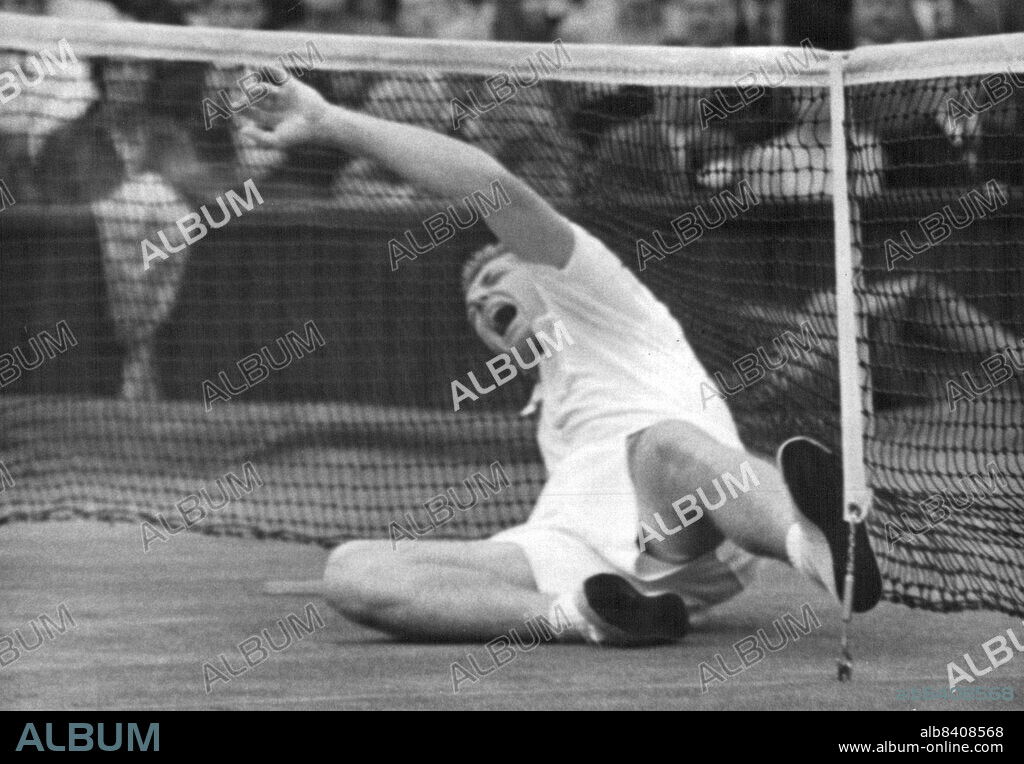 1955 All England Lawn Tennis Championships At Wimbledon: Trabert Reaches Finals.In a rush to the net during his semifinal match against Budge Patty, Tony Trabert slips, falling heavily and his face contorts in pain as he his leg twists beneath him. Play was held up for a time but Trabert recovered and went on to win.The semi-finals of the Mens singles championships of the All England Lawn Tennis Tournament took place yesterday at Wimbledon. Tony Trabert of the U.S.A. reached the final by beating his compatriot Budge Patty in three straight sets. June 29, 1955. (Photo by Fox Photos).