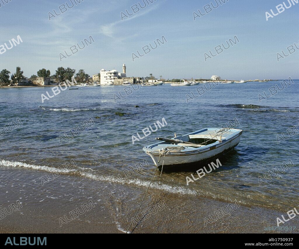 Syria. Latakia. View of the Blue Beach with boat stranded in the sand. Northern part of the city. Mediterranean coast. Photo taken before the Syrian civil war.