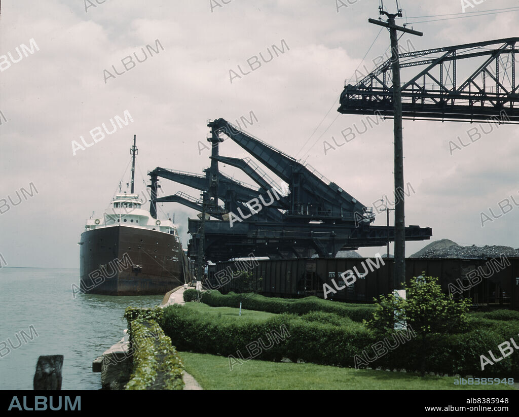 JACK DELANO. Pennsylvania R.R. [Railroad] ore docks, unloading iron ore from a lake freighter by means of "Hulett" unloaders, Cleveland, Ohio.