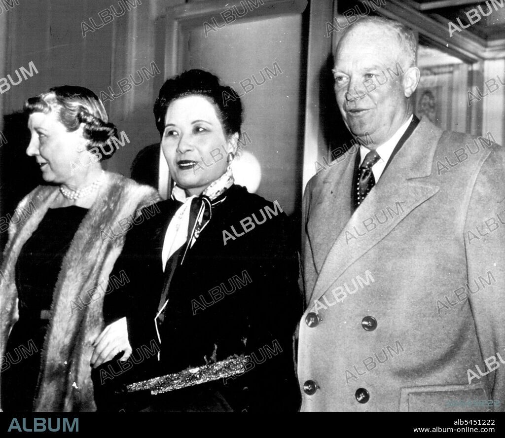 After Tea At The White House -- Madame Chiang Kai-shel (center), wife of the Chinese Nationalist Generalissimo, poses with President and Mrs. Dwight Eisenhower late today after the visitor from Formosa had tea with the Eisenhowers. March 09, 1953. (Photo by AP Wirephoto).