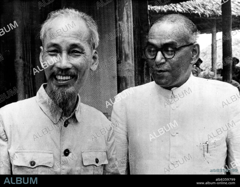 Ho Chi-Minh Rules Handi : Ho-Chi-Minh, President of the Vietmin Republic (left) with Sri. M.J. Desai, Chairman of the International Commission for supervision and control in Vietnam, when they met recently at Thai Nguyen, 65 miles north of Handi.The red flag of Viet Minh now flies over the city of Handi. The green uniforms of the Viet Minh police force can be seen in all the police stations... The French have honoured the Geneva agreement in letter and spirit. October 11, 1954. (Photo by Paul Popper, Paul Popper Ltd.).