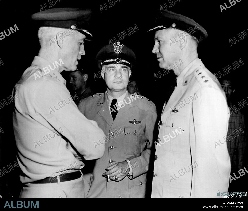 Lt. Gen. Otto P. Weyland, right, and Maj. Gen. Frank F. Everest center, law commanders of the Far East Air Forces and the Fifth Air Force, are greeted by Lt. Gen. Earle E. Partridge at Haneda Airport on their arrival from the United States. Gen. Partridge, former Fifth Air Force commander, had assumed temporary command of FEAF due to illness of Lt. Gen. George E. Stratemeyer. May 30, 1951. (Photo by U. S. Air Force Photo).