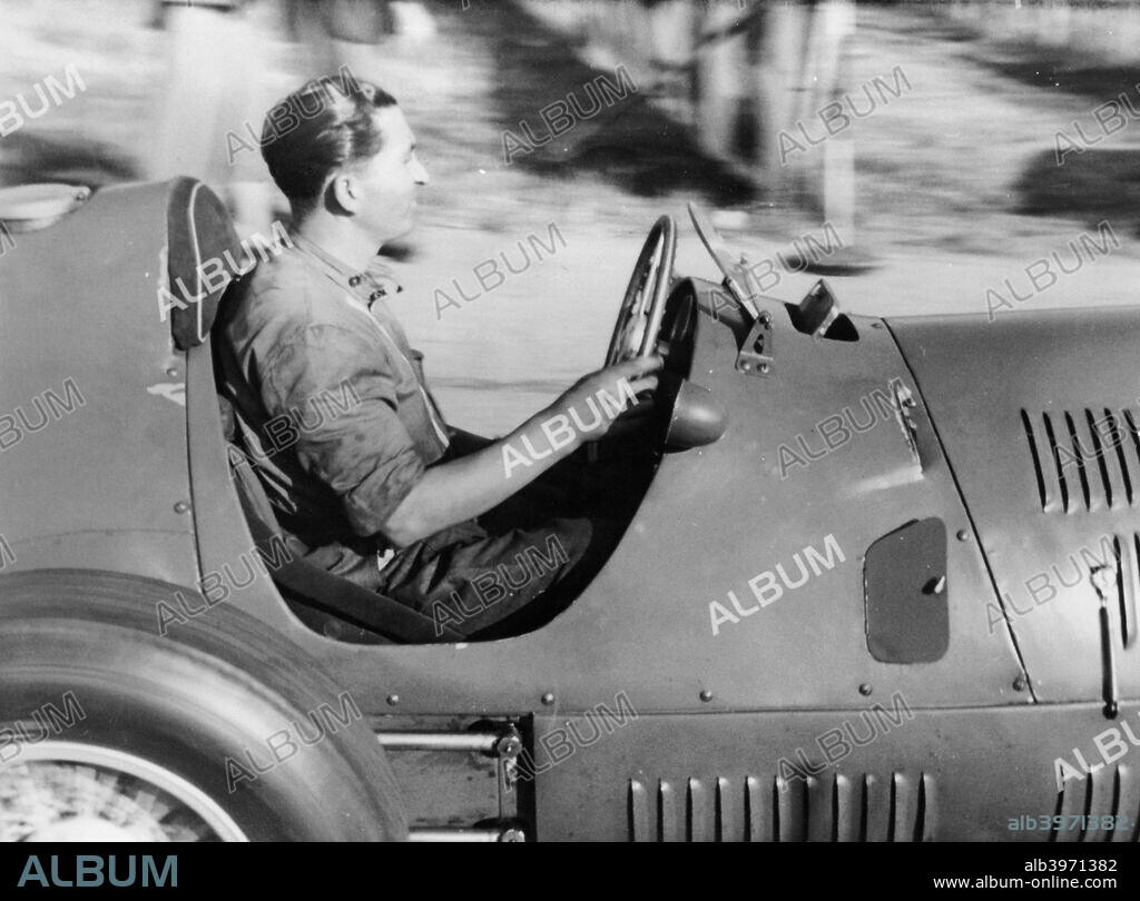 Alberto Ascari at the wheel of a racing car. Enzo Ferrari signed Ascari up in 1949, and he won many races for Ferrari between 1950 and 1952. He was World Champion in 1952 and 1953. In 1952 he won every Grand Prix, and didn't lose a race until the middle of 1953. He performed the unrepeated feat of winning nine straight Grands Prix.
