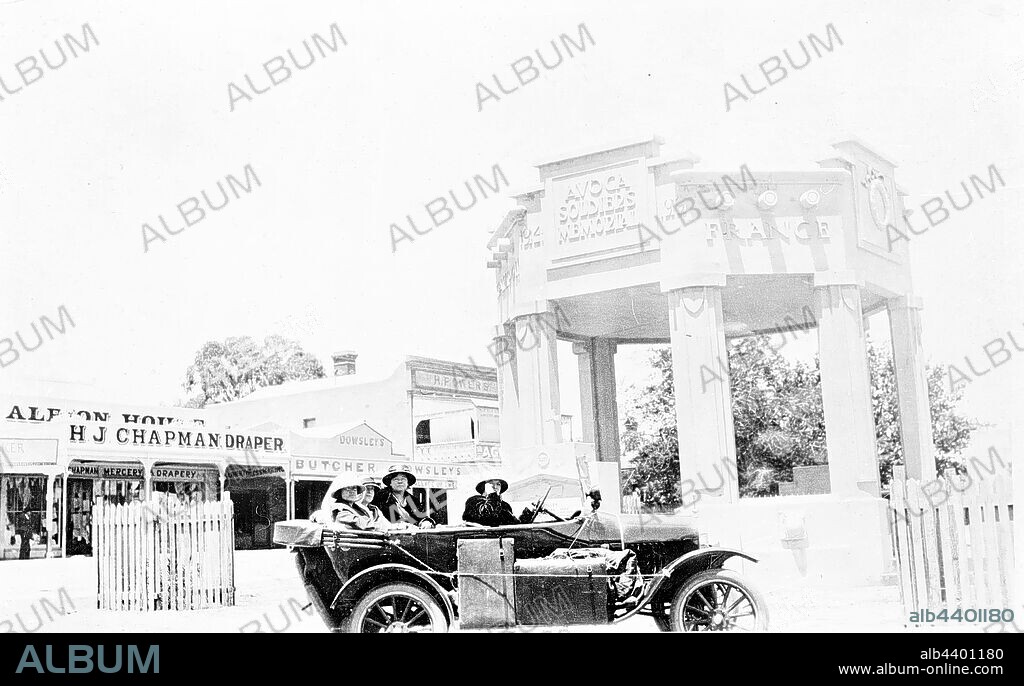 Negative - Avoca, Victoria, circa 1925, A Model T Ford motor car in front of the Avoca Soldier's Memorial. The shop of H.J. Chapman, Draper is in the background.