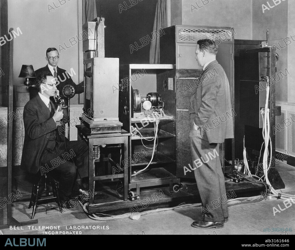 New York, New York: c. 1929 A demonstration of the transmission apparatus for television at Bell Labs. Seated left in front of the photoelectric cells is R.C. Mathes and behind him is J.W. Horton, both members of the technical staff. On the right facing a motor of his design is H.M. Moller who is largely responsible for the development of synchronization in TV.