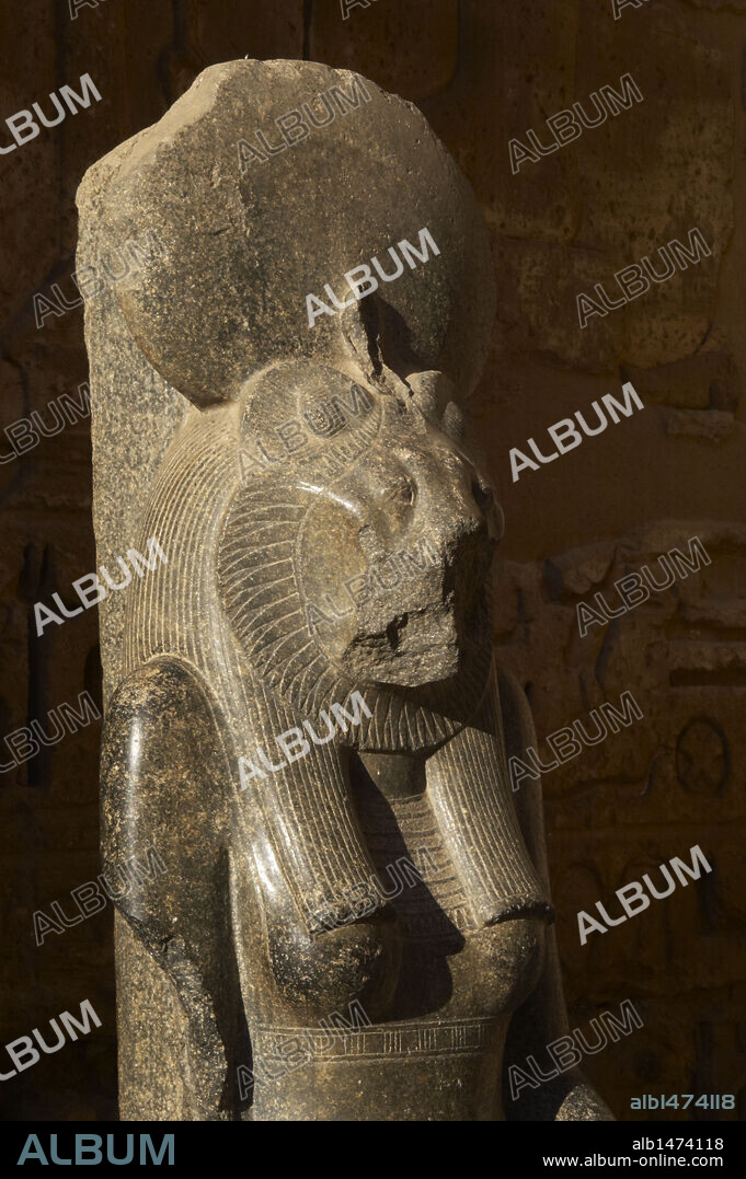 Goddess Sekhmet, goddess of war, represented with head of a lioness and the human body and crowned with the solar disk. Detail. Sculpture in the mortuary temple of Ramses III (1187-1156 BC). New Kingdom. Medinet Habu. Egypt.
