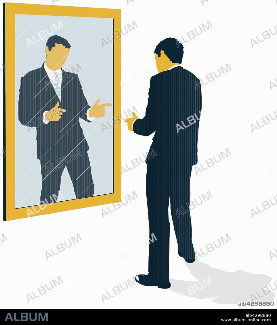 Confident businessman looking at reflection and pointing in mirror.