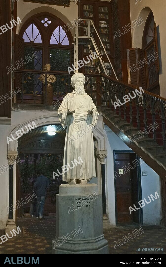 India: Statue of merchant and leader of the Jewish community in Bombay, David Sassoon (1792 - 1864), Sassoon Library, Kala Ghoda, Fort, Mumbai. Sassoon was born in Baghdad, where his father, Saleh Sassoon, was chief treasurer to the pashas (the governors of Baghdad) from 1781 to 1817, and leader of the city's Jewish community. Following the persecution of Baghdad's Jews by Daud Pasha, the family moved to Bombay via Persia. Sassoon was in business in Bombay no later than 1832, originally acting as a middleman between British textile firms and Gulf commodity merchants.