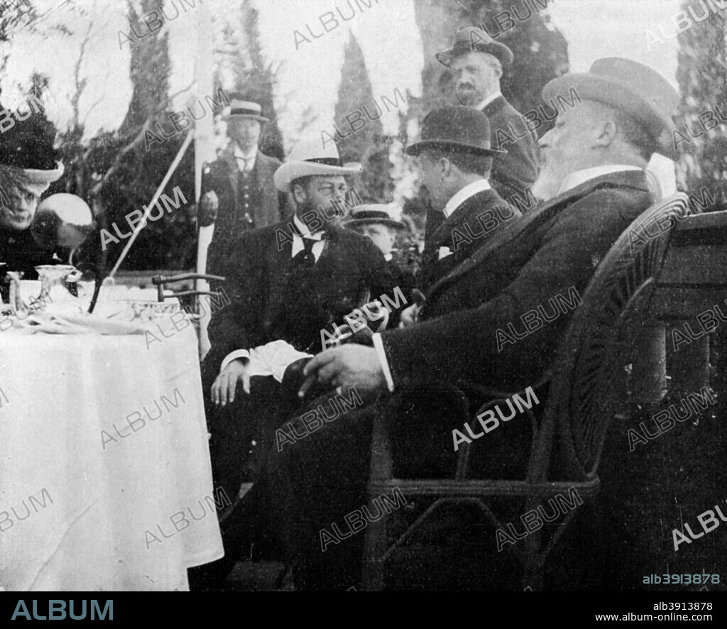 Prince George (1865-1936), the future King George V, Corfu, Greece, 1908. The prince is seen here at a tea party at the Villa Mon Repo. From Queen Alexandra's Christmas Gift Book, Photographs from My Camera, by Queen Alexandra, published by The Daily Telegraph (London, 1908).