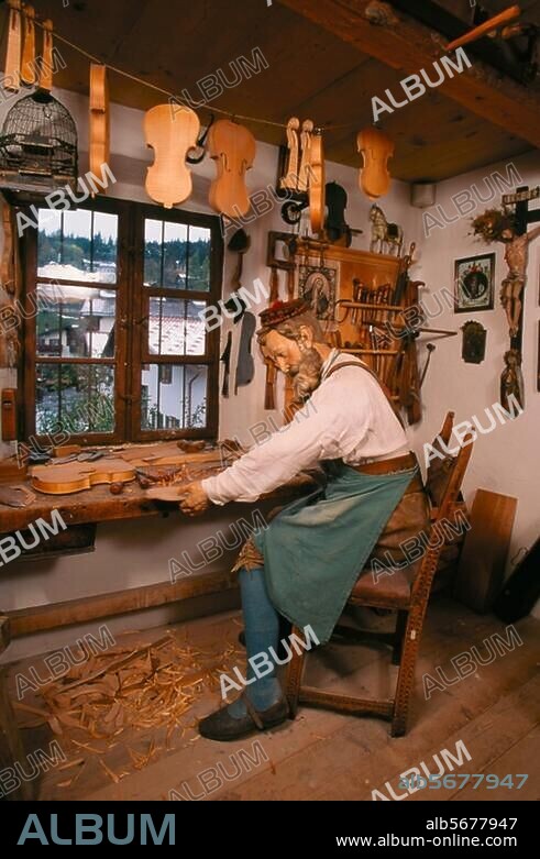 Craft and Trade / Violin maker. Historical violin making workshop: Violin maker at work.