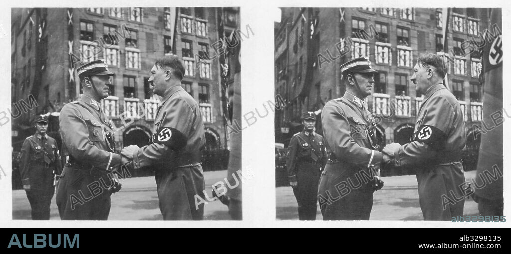 Adolf Hitler welcomes Gruppenfuhrer Juttner at the 1937 Nuremberg Rally of Work.