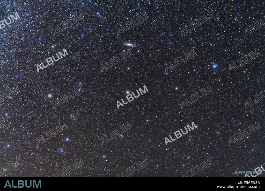 Full frame image showing the Andromeda Galaxy (Messier 31), at upper center, the Triangulum Galaxy (Messier 33), below center, NGC 752 star cluster (left of center), and Messier 34 cluster at left edge. The small constellation of Triangulum is bottom left.
