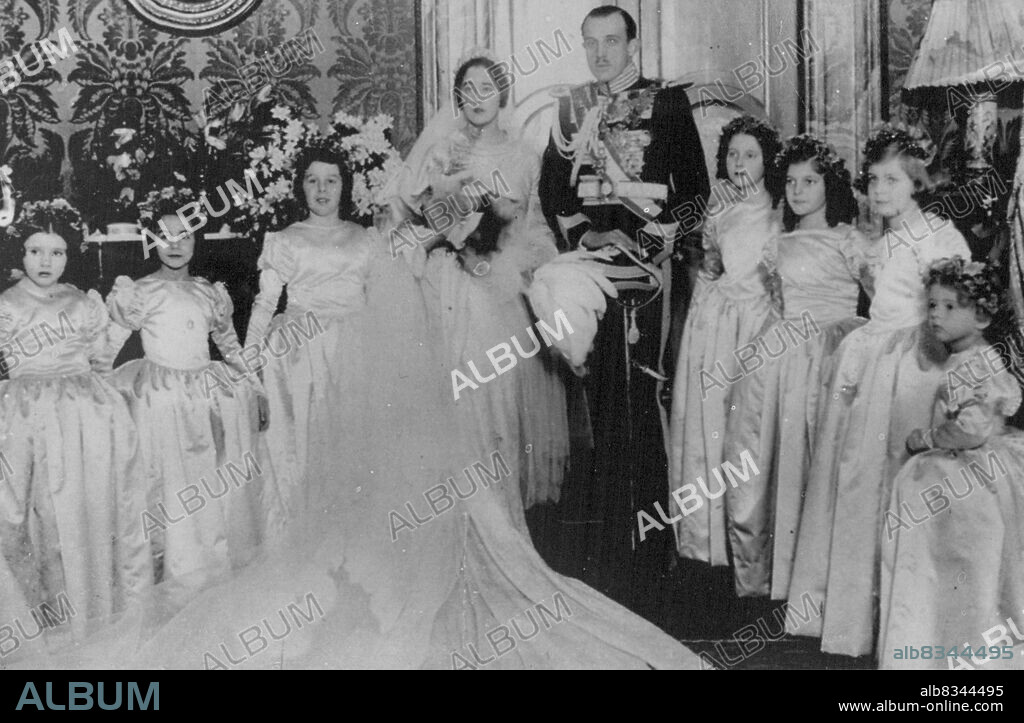 ***** of Ex-King Alfonso Weds. Ding took Place at St. Innatius Church, Rome yesterday Jaime, Second Son of Ex-King Alfonso of Spain, and Emanuela De Dampierre. The Bride and Bridegroom and Bridesmaids photographed After The Ceremony. The Bridegroom is the Uniform of a Commander of Seville. March 05, 1935. (Photo by Keystone).