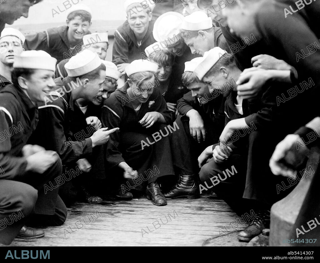 Shooting craps on USS New York. Craps is a dice game in which the players make wagers on the outcome of the roll, or a series of rolls, of a pair of dice. Players may wager money against each other (playing street craps) or a bank (playing casino craps AKA table craps. Because it requires little equipment, street craps can be played in informal settings. Bain News Service, crier 1910-15 (cropped and cleaned).
