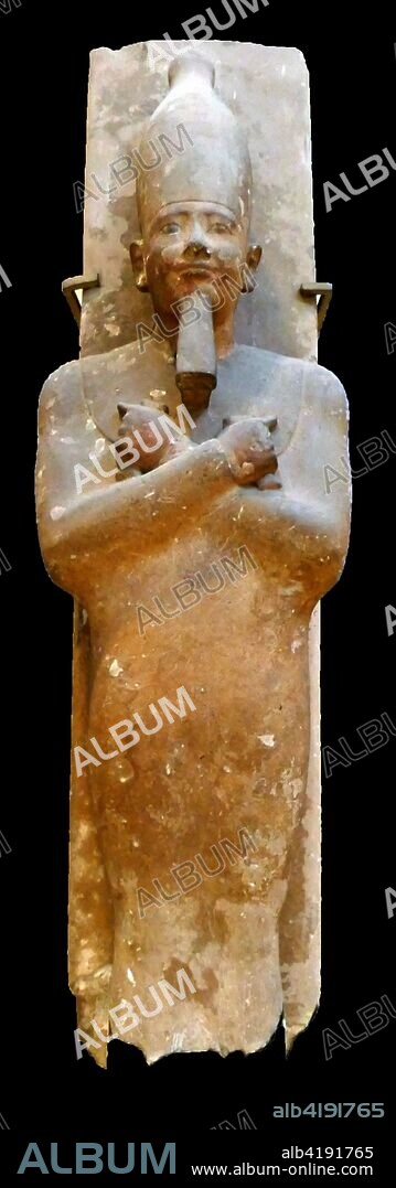 Statue of king Senusret I. represented as Osiris. found with five other statues at the outer enclosure wall of the Pyramid of King Senusert I at El-Lisht. Sandstone? Middle Kingdom. 12th dynasty. reign of Senusert 1 (ca. 1961-1917 B.c).