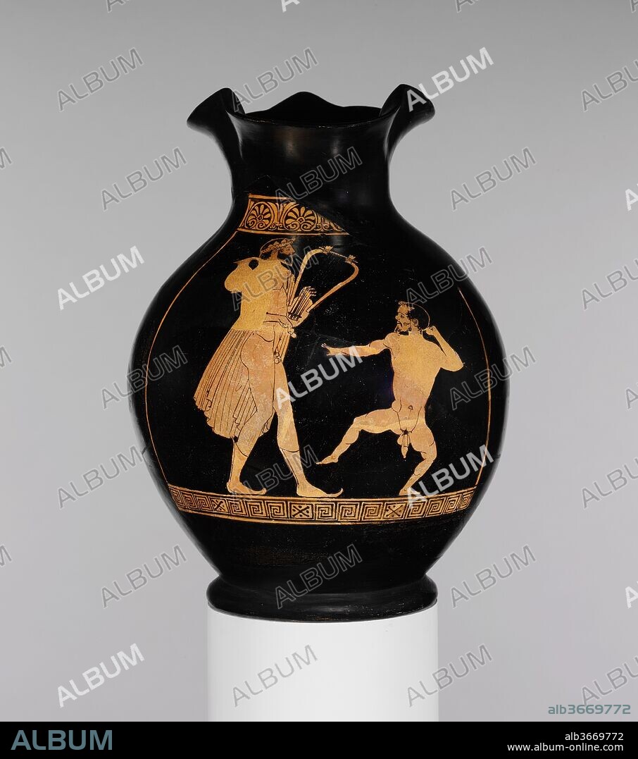 Terracotta oinochoe: chous (jug). Culture: Greek, Attic. Dimensions: Diam.: 7 3/8 x 10 in. (18.7 cm) ( foot, D. 4 5/16"). Date: ca. 450 B.C..
Komast (reveler) and dancing dwarf
This representation is noteworthy for the characterization of the two figures. The tall komast advances deliberately, playing the barbitos, a form of lyre. His head is wreathed, his cloak and a chous are slung over one shoulder, and he wears soft, high boots. The dwarf before him presents a considerable contrast with his jerky movements, nudity, pugnacious expression, and straggly beard.