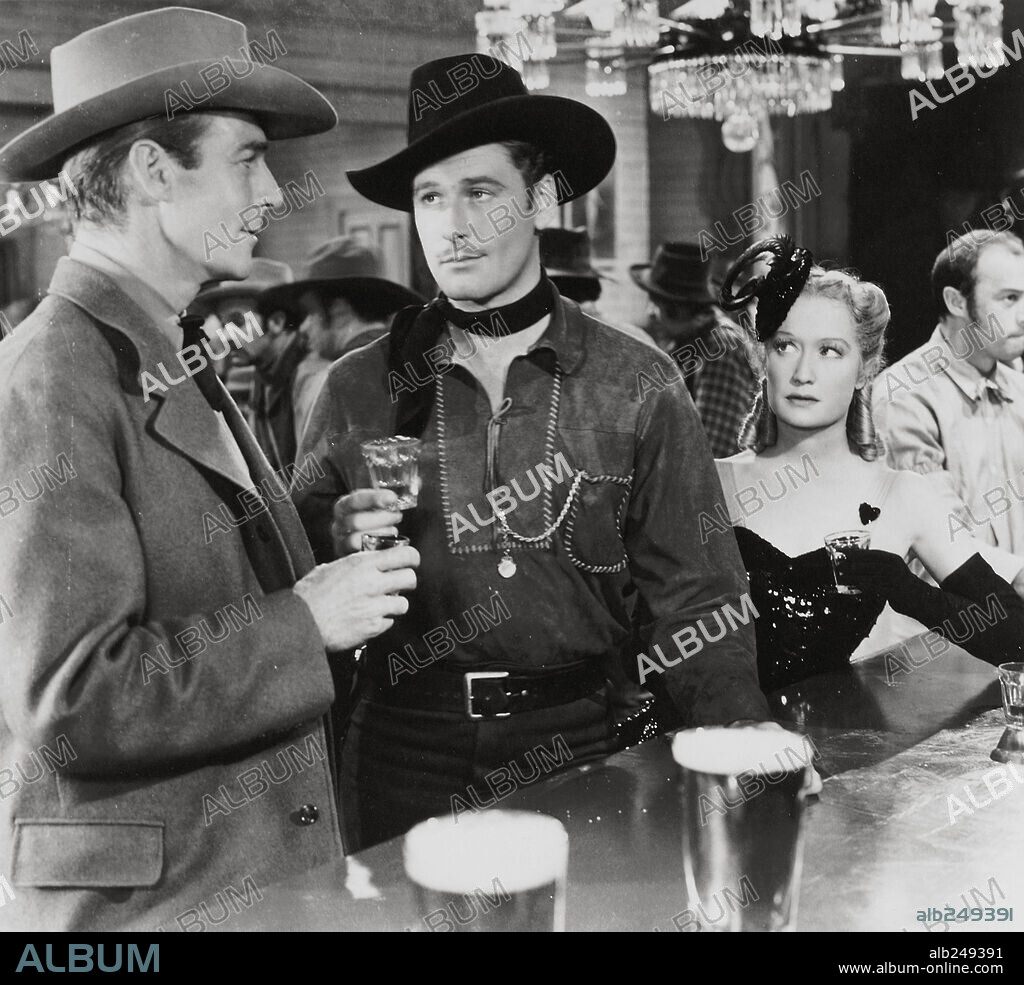 ERROL FLYNN, MIRIAM HOPKINS and RANDOLPH SCOTT in VIRGINIA CITY, 1940, directed by MICHAEL CURTIZ. Copyright WARNER BROS/FIRST NATIONAL.